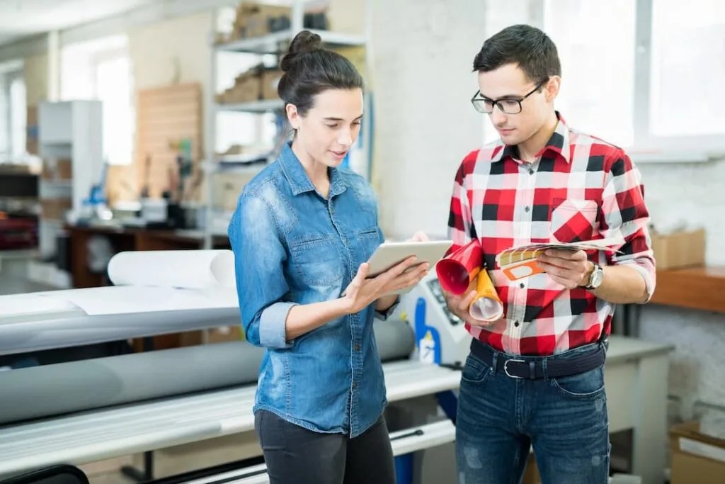 printing-experts-discussing-design-and-paper-creative office solutions